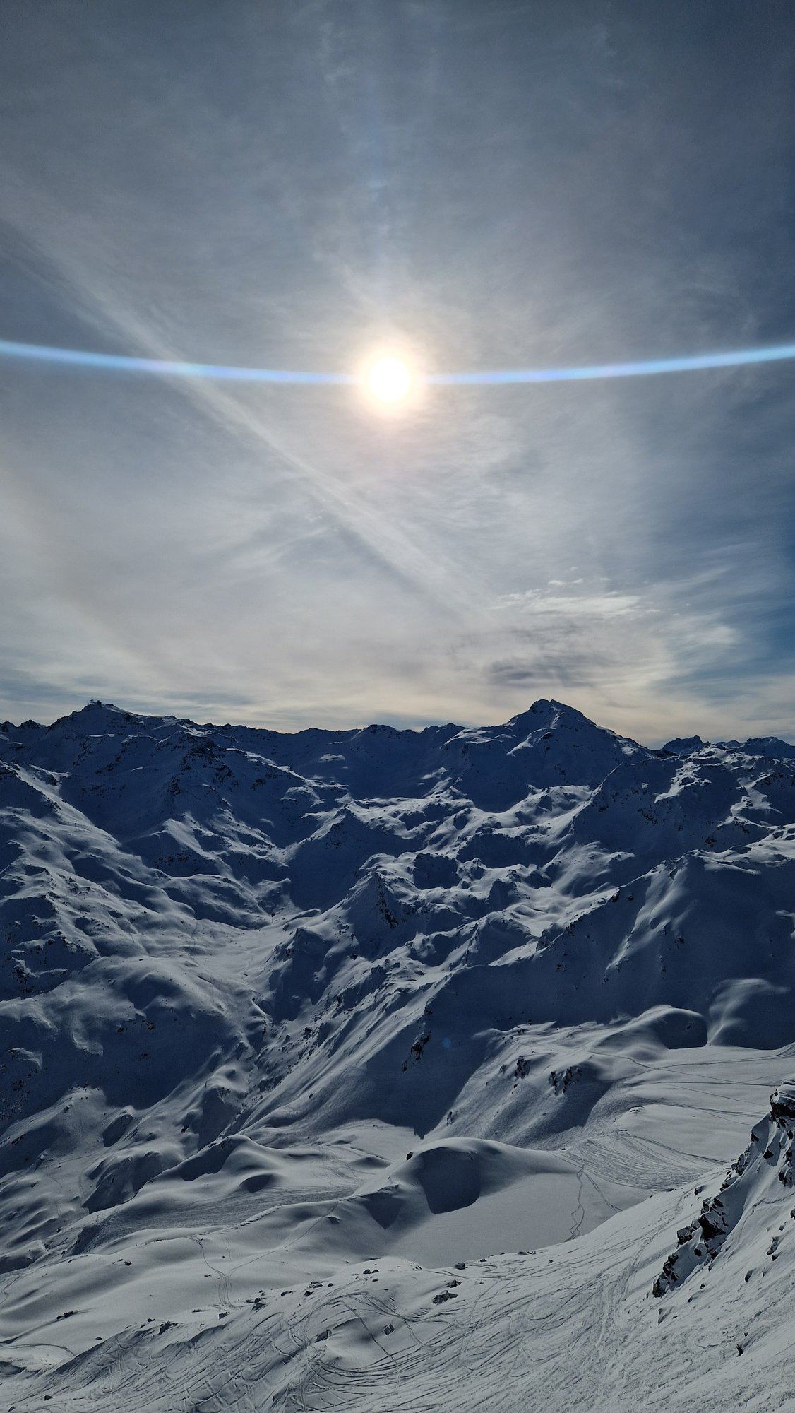 Chairlifts on the snowy slopes of the 4 Vallées